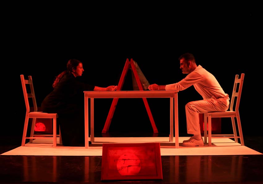 A woman and a man sitting at a table